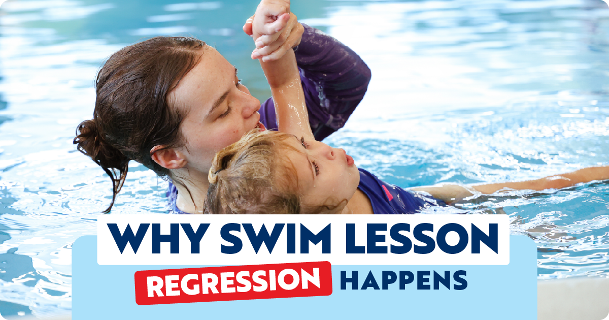 A photo of an instructor and child in the pool, with the instructor holding the child's arm above their head, showing them how to move their arms during a swim stroke.